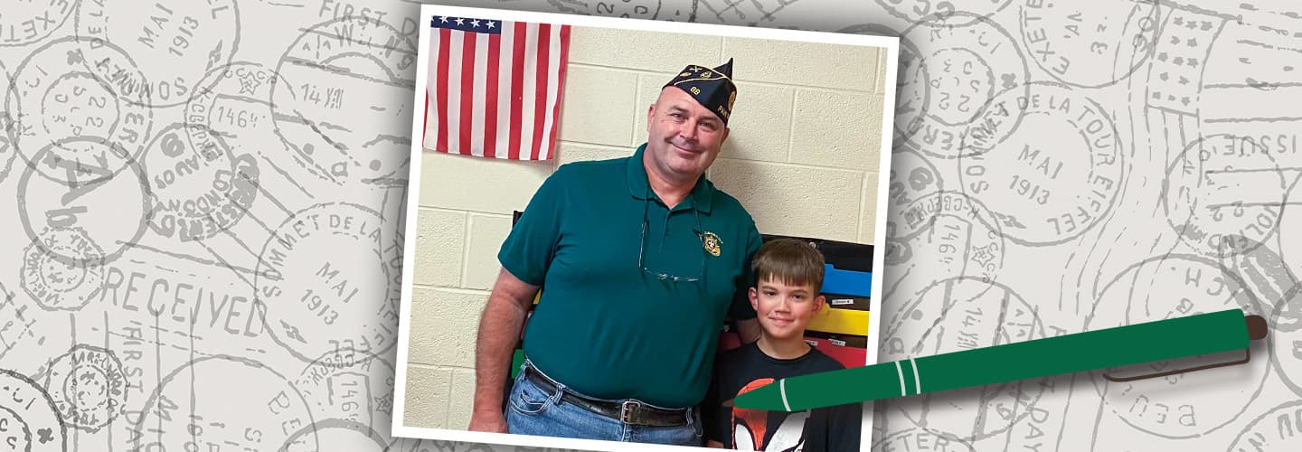 a veteran smiles with a young boy