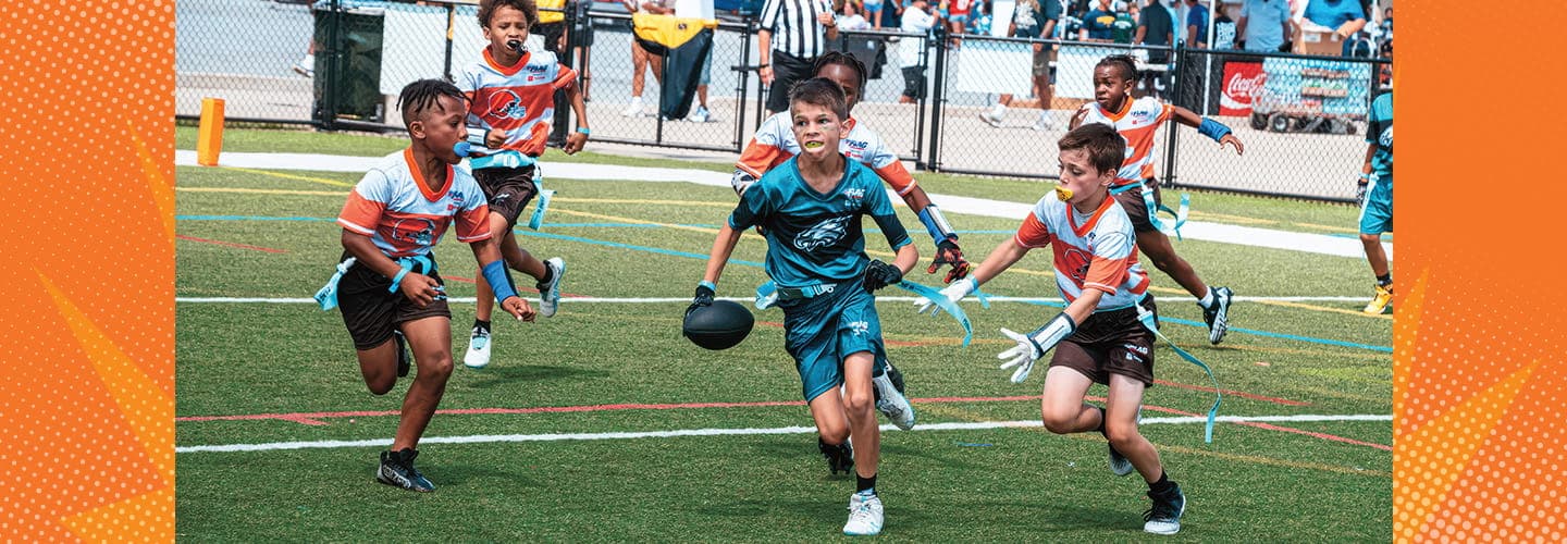 a group of kids playing flag football