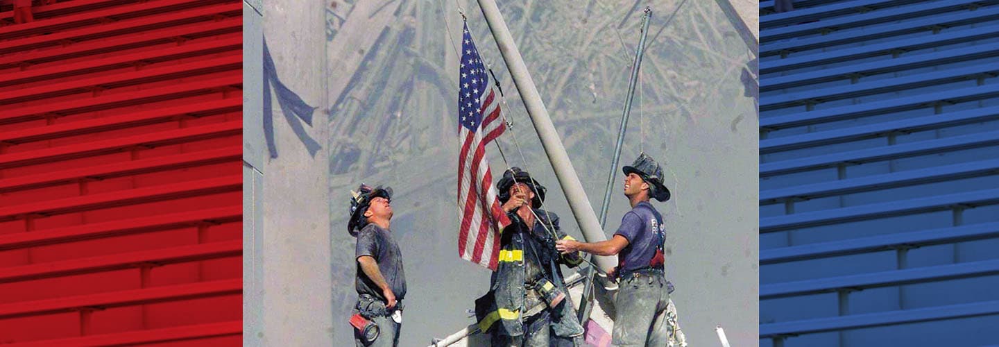 Image of firefighters raising the American flag